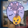 Sticker sur vitre Halloween Chauve-souris amusante portant une citrouille